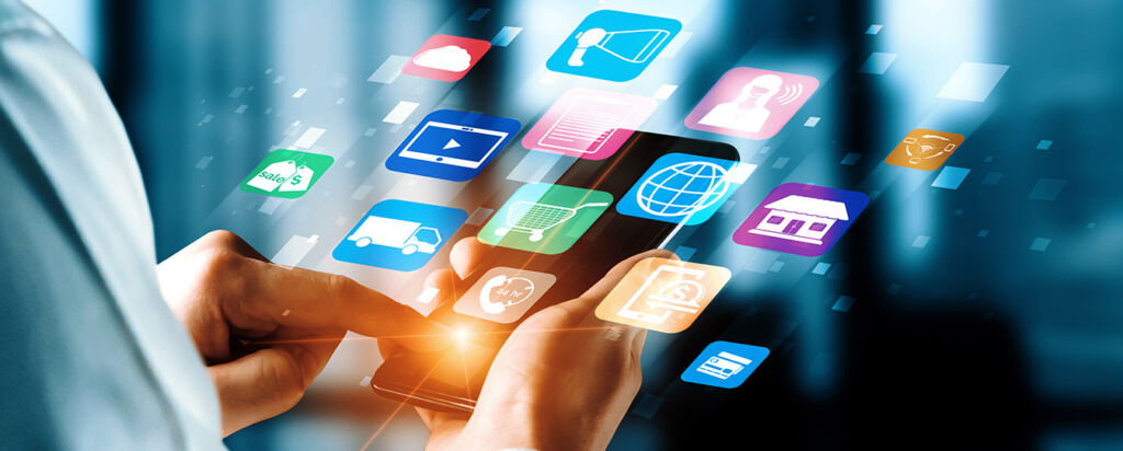 Person using a smartphone with colorful digital marketing and e-commerce icons floating above the screen, representing online business and mobile engagement.